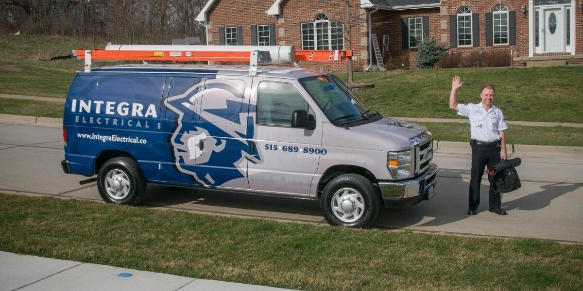 Technician waving from a service van