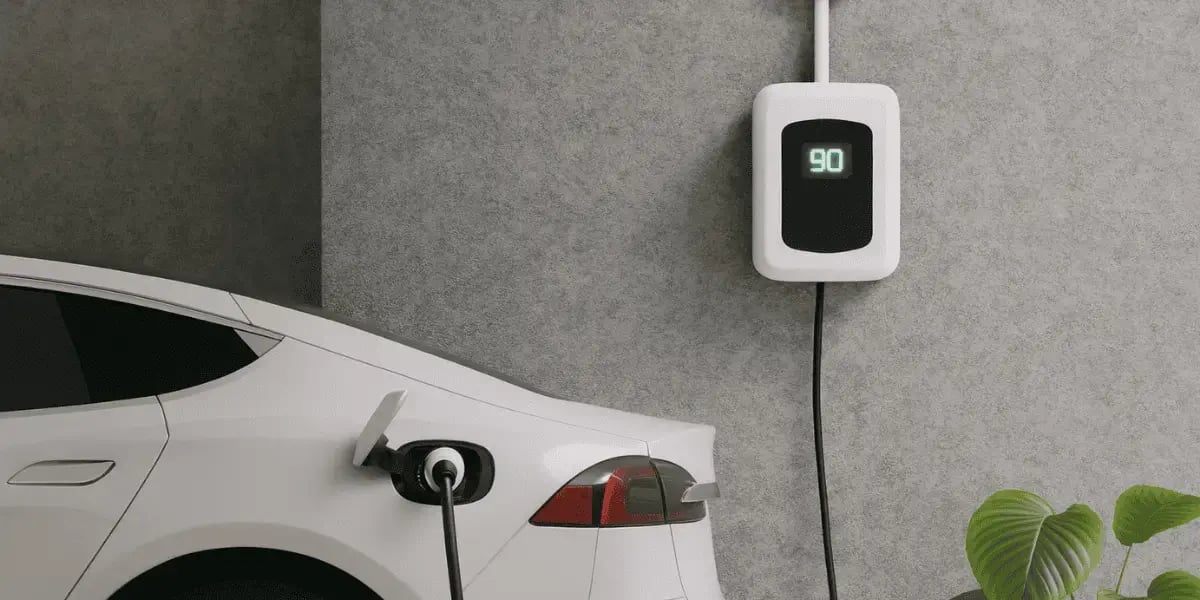 White Electric Vehicle charging in garage - plugged into EV Charger in Des Moines IA