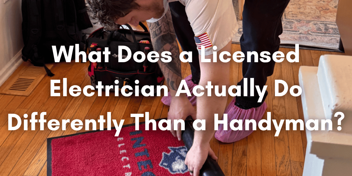 Licensed electrician working inside a home with tool bag nearby, illustrating the difference between a licensed electrician and a handyman.