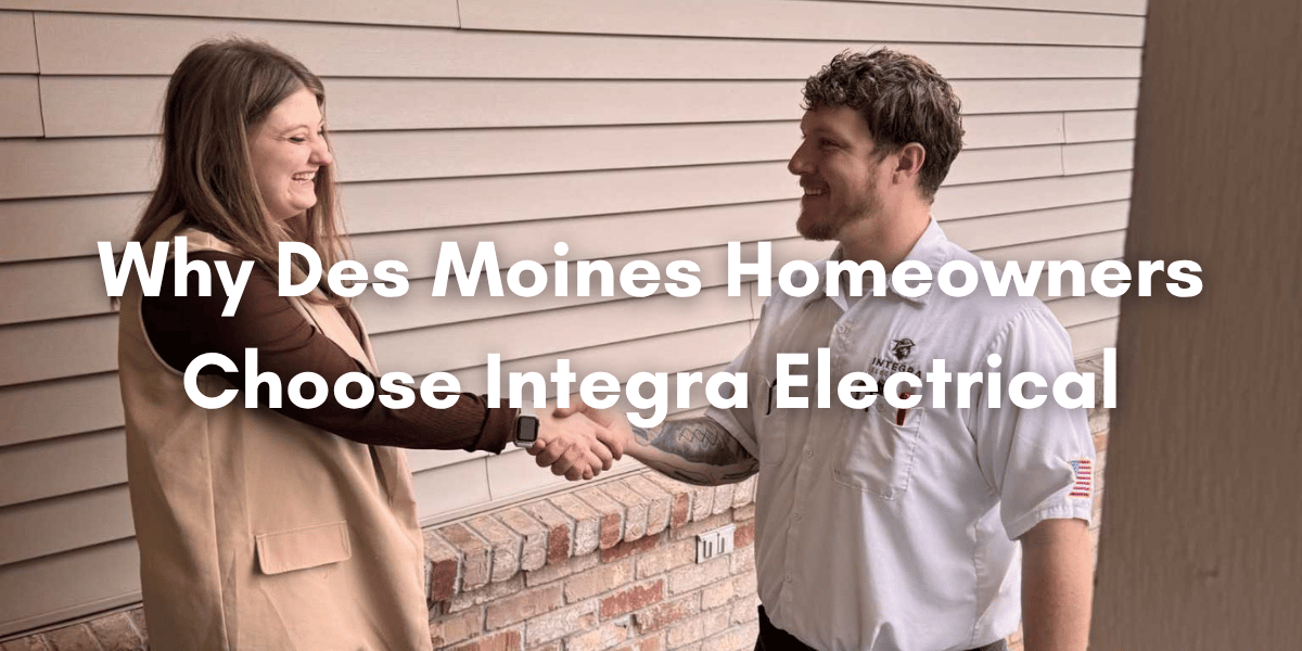 A homeowner shakes hands with an Integra Electrical technician outside a home in Des Moines, with text overlay reading “Why Des Moines Homeowners Choose Integra Electrical.”
