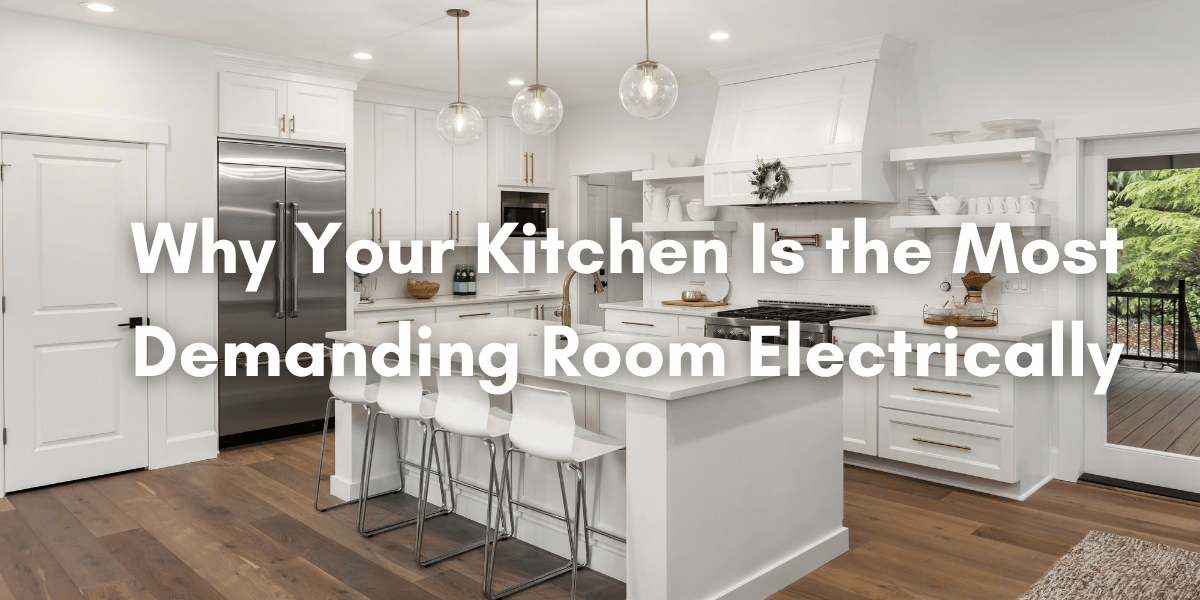 Modern white kitchen with stainless steel appliances, island seating, pendant lighting, and overlaid text reading “Why Your Kitchen Is the Most Demanding Room Electrically.”
